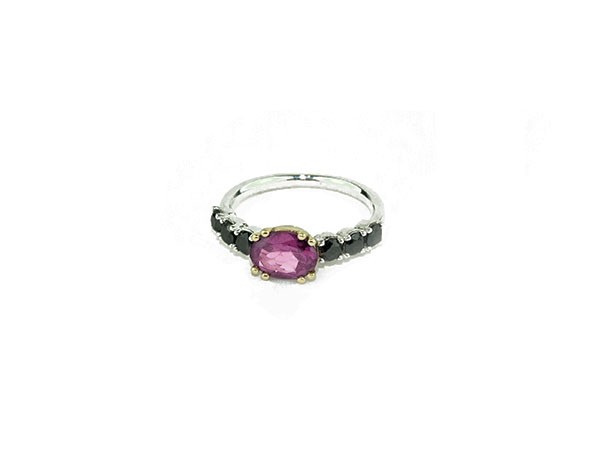 Silver and yellow gold ring with central Rhodolite and 6 side black brilliants Silver and yellow gold ring with central Rhodolite and 6 side black brilliants