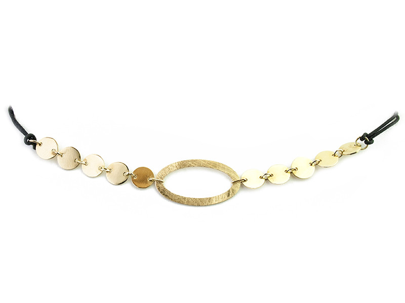 Necklace consisting of a matte vague center and polished yellow gold plates, mounted with a black cotton cord and a gold clasp. Necklace consisting of a matte vague center and polished yellow gold plates, mounted with a black cotton cord and a gold clasp.