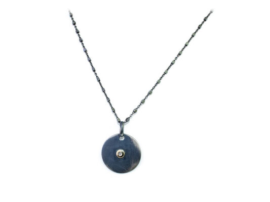 Penjoll de plata rovellada i setinada de 925mm combinada amb boca d´or groc i 1 brillant de 0.02cts.