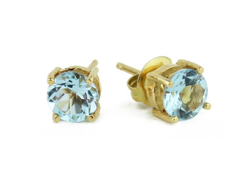 Gold earrings with Blue Topaz stone. Gold earrings with Blue Topaz stone.