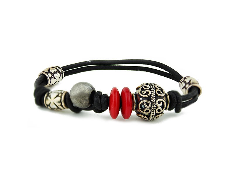 Leather and rubber bracelet with silver pieces and resin discs. Leather and rubber bracelet with silver pieces and resin discs.
