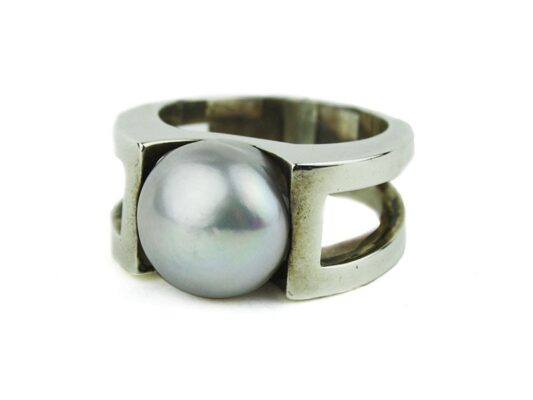 Silver open arm ring with gray pearl.