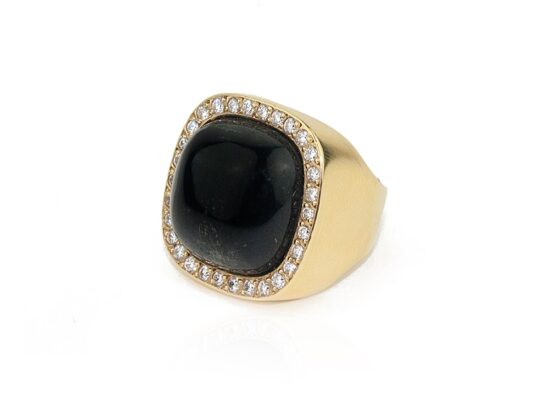 Gold ring with green tourmaline and diamonds.