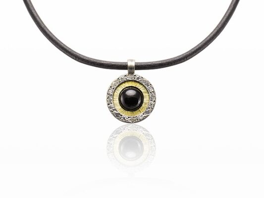 Pendant made of silver, yellow gold, onyx and white diamonds.
