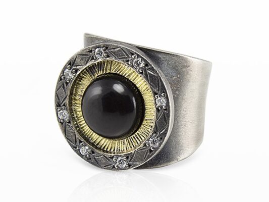 Silver and yellow gold ring with white diamonds and onyx.