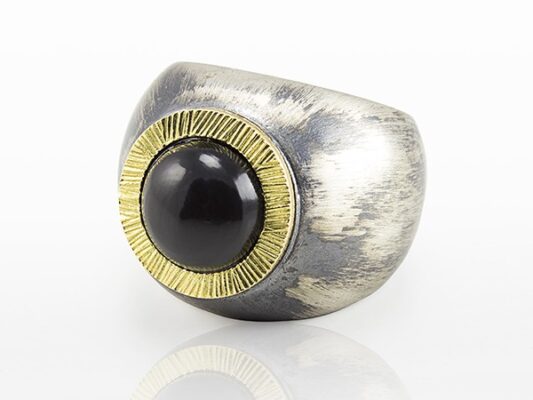 Silver and yellow gold ring with onyx.