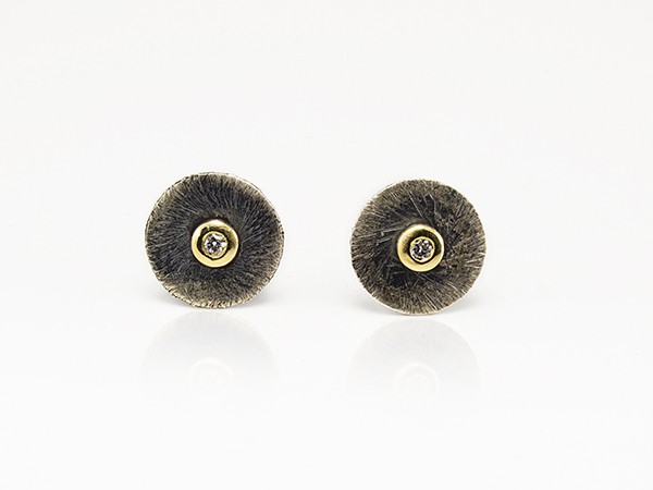 Silver and yellow gold earrings with white diamond. Silver and yellow gold earrings with white diamond.