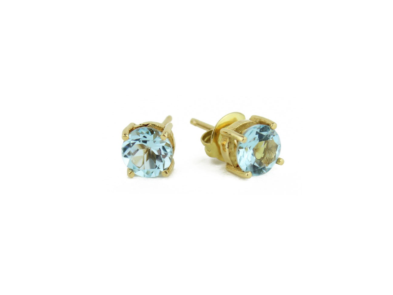Gold earrings with Blue Topaz stone. Gold earrings with Blue Topaz stone.