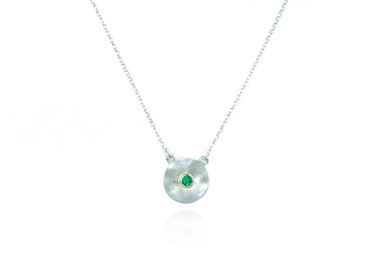 Silver, yellow gold and emerald necklace.