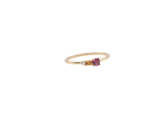 Yellow gold ring with natural stones and a diamond.