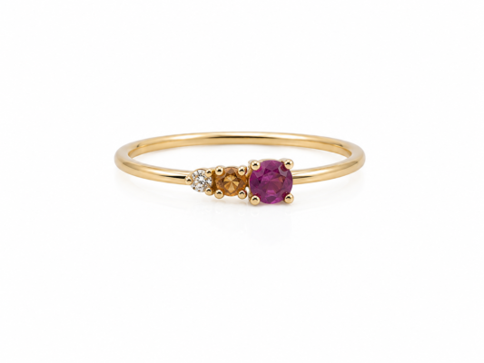 Yellow gold ring with natural stones and a diamond.