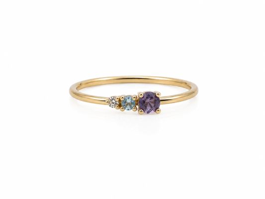 Yellow gold ring with natural stones and a diamond.