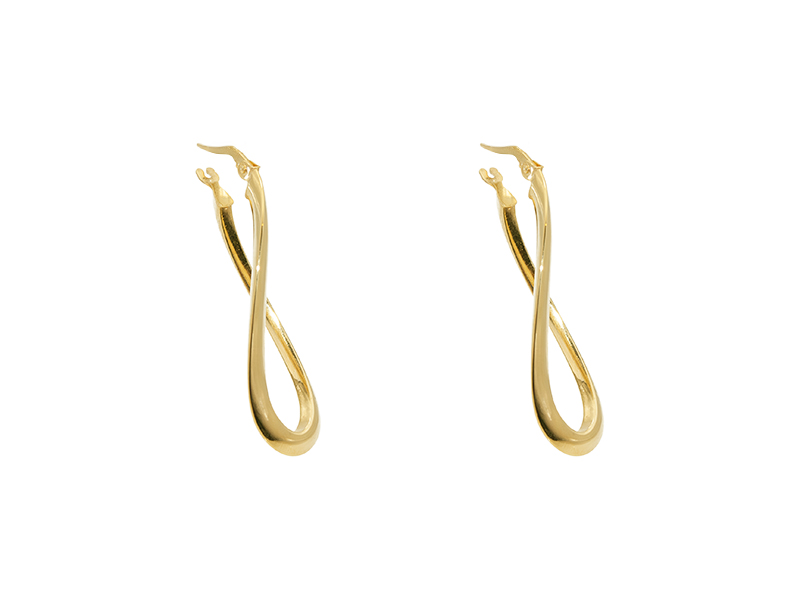 Wavy yellow gold hoops. Wavy yellow gold hoops.