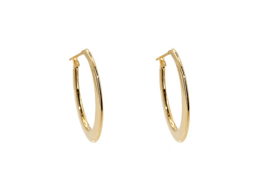 Oval-shaped yellow gold hoops.